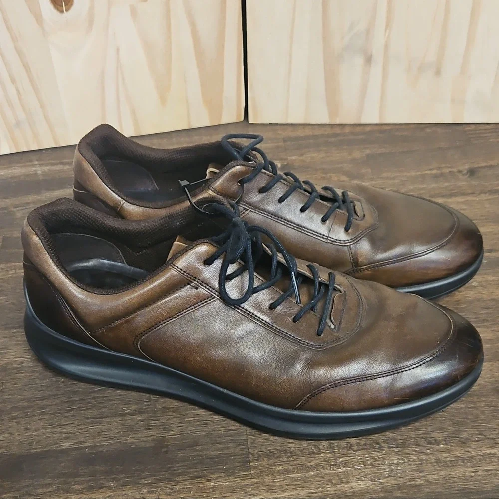 These are ECCO Aquet Men's Sneakers in a rich, dark brown leather finish.